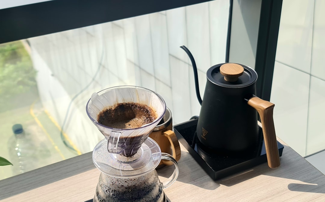 habit stacking - Brewing coffee with a kettle by the window.