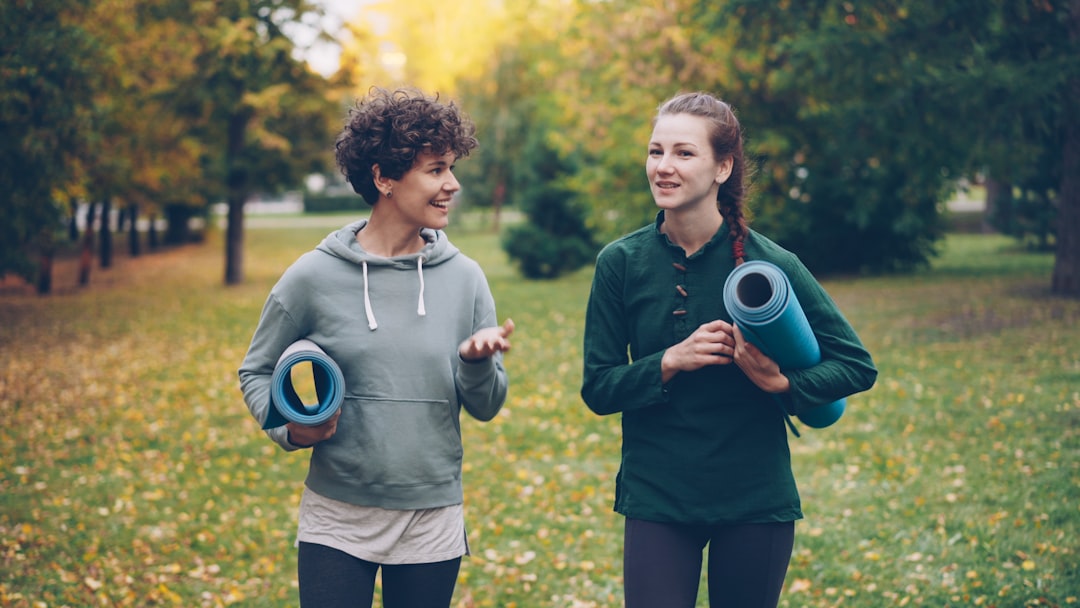 Friendly competition health benefits - friends exercising together outdoors