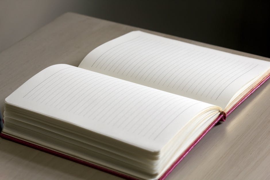 journaling for mental health benefits - Open lined notebook on a wooden desk with soft natural lighting.