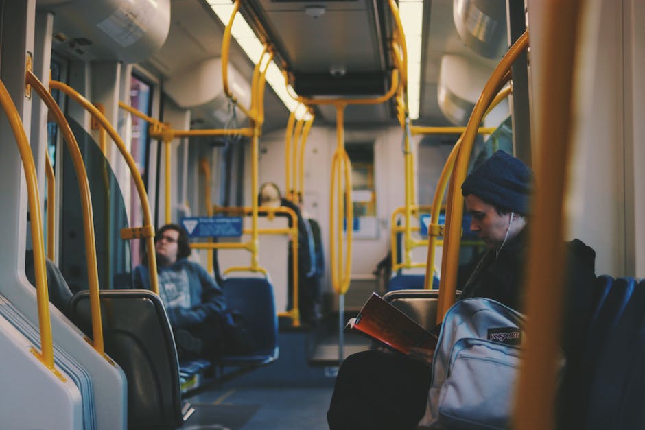 mindful commute - Commuters engaging in reading and relaxing on a modern Portland tram.