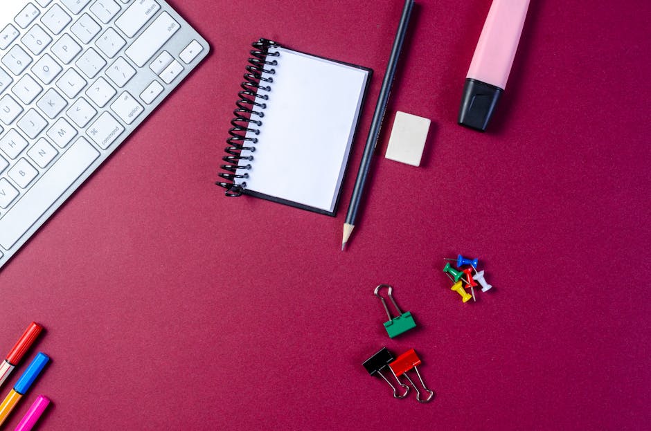 friction reduction - Flat lay of stationery items and keyboard on a vibrant desk.