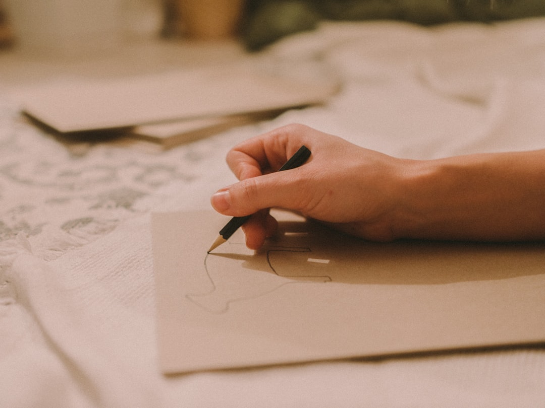 habit friction reduction - person writing on white paper