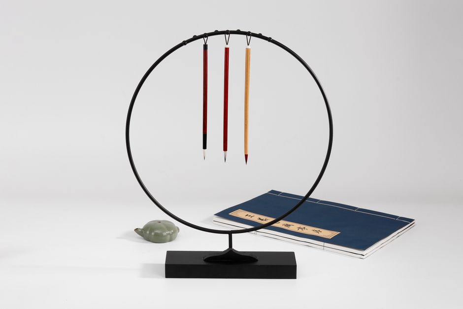 monotasking - A minimalist composition showcasing traditional Japanese calligraphy brushes and writing materials.