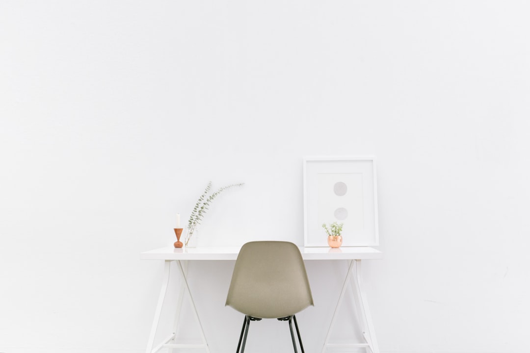 monotasking - white wooden table near brown chair